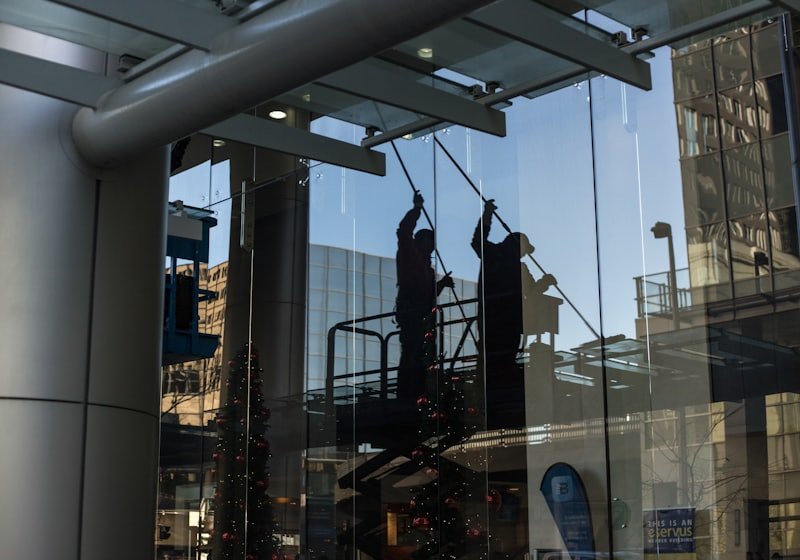 Window cleaners working on a commercial building facade