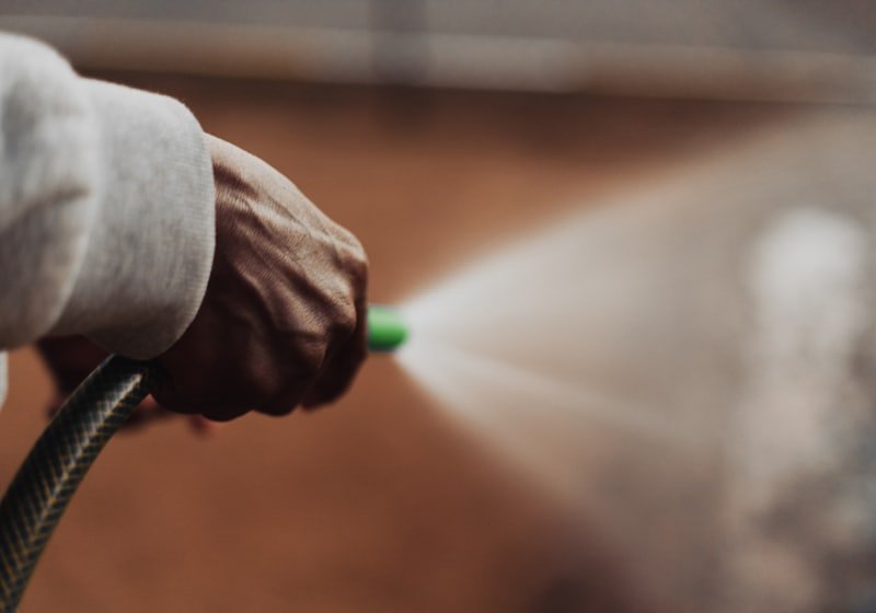 Close-up of a pressure washer nozzle spraying water